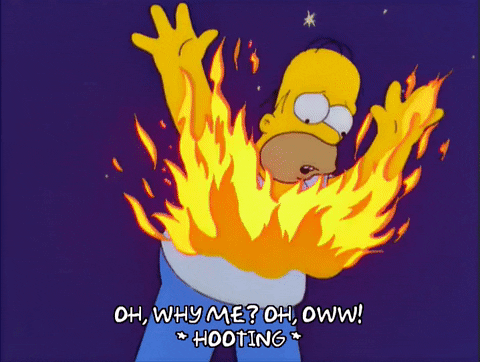 Simpsons gif. Homer is on fire and he raises his hands in the air while yelling and running around screaming, "Oh, why me!! Oh, Ow!"