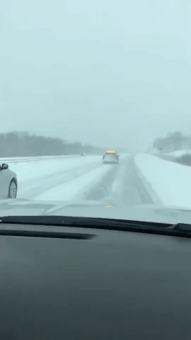 Police Guide Drivers Through Snow-Covered Roads in Minnesota