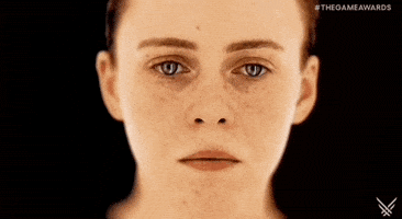 Video game gif. Closeup of just Sophia Lillis" face and neck, eyes lowered and welling up with tears. All of a sudden, she shakes with intensity and screams, looking at us with a terrified expression. 