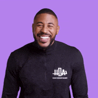 Sports gif. Blaise Ffrench, a black man with a medium skintone and trim beard from the Hockey Diversity Alliance, leans forward and laughs heartily like he's cracking up during an interview.