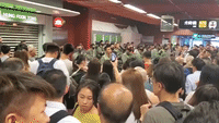 Crowd Shouts at Police in Hong Kong's Tai Koo Station