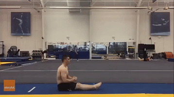 Gymnast Effortlessly Executes Sitting Back Flip
