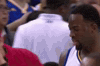 Sports gif. During an NBA game, a frustrated Draymond Green of The Golden State Warriors walks off the court, shaking his head in disagreement.