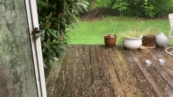 Woman Catches Hail During Storm in Roswell, Georgia