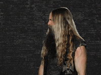Celebrity gif. Tilting his head to the side, Zakk Wylde slowly turns his face toward us, squinting and confused.