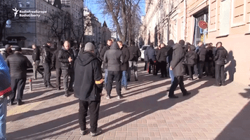 Ukrainians and Foreigners Line Up for Weapons to Defend Kyiv