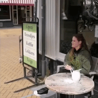 Dutch Cafe Demonstrates How to Serve Customers From a Distance (and How Not to)