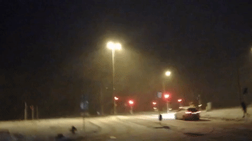 Blizzard Winds Push Tourist Across Pavement in Reykjavík
