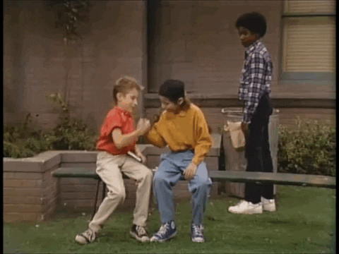 TV gif. Young versions of Joey and Danny from Full House try to be cool as they do a complicated handshake at school as a Black classmate looks on, shaking his head in disgrace.