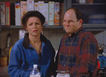 Seinfeld gif. Julia Louis Dreyfus as Elaine and Jason Alexander as George both flash "ok" hand symbols with sarcastic facial expressions; Elaine frowns and purses her lip and George squints and nods.