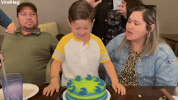 Kid Smashes Face into Birthday Cake