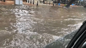 Cars Drive Along Flooded Street in Monsoon-Hit Chennai