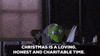 Cartoon gif. Kermit from The Muppet Christmas Carol. He sits at a desk in a suit and looks up while giving us a gentle smile and says, "Christmas is a loving, honest, and charitable time."