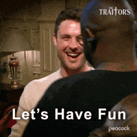 Sponsored gif. Traitors cast members Bob the Drag Queen and Dylan Efron smile as they grasp hands in camaraderie. Text reads, “Let’s have fun.”