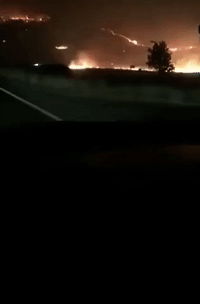 Motorists Watch as Grove Fire Burns Through North Central California