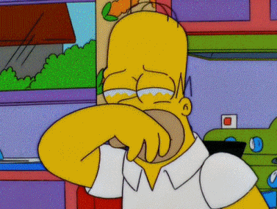 The Simpsons gif. Homer holds a hand over his face and tears well under his eyes as he sobs. 