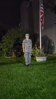 Teenage Boy Plays 'Taps' With Flag at Half-Mast to Honor US Personnel Killed in Kabul Attacks
