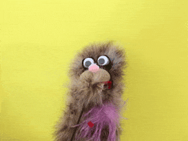 Video gif. Carl puppet blows a big kiss.