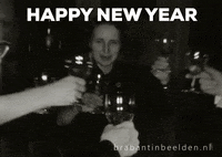 Video gif. A group of women in a black and white gif lean in to toast with their champagne glasses to ring in the new year, animated fireworks bursting over their clinking glasses. Text, "Happy new year."