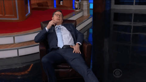 relaxed stephen colbert GIF