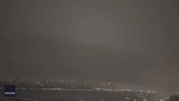 Lightning Flashes Above Manhattan Skyline