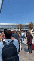 Passengers Stand in Hours-Long Line for Heathrow Security