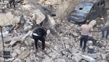 People Survey Rubble After Strike Damages Orthodox Church in Gaza