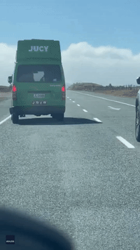 Car Swerves to Avoid Toppled Motorhome During Strong Winds in New Zealand