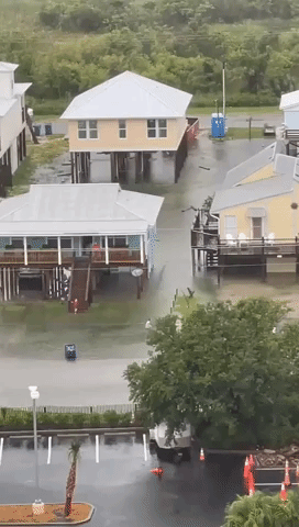 Children Splash Around Tropical Storm Elsa Floodwaters in Gulf Shores