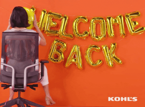 Ad gif. Kohl's ad shows gold letter balloons on an orange wall that read "Welcome back," and a woman facing the wall spins around toward us in an office chair with a smiley-face balloon over her face.