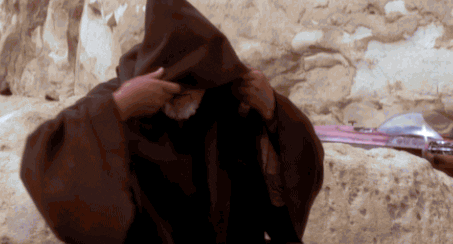 Movie gif. Alec Guinness as Obi Wan Kenobi in Star Wars: A New Hope pulls back the hood of his cloak and gives a nod of recognition. Text, "hello there."