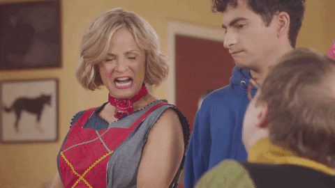 TV gif. Amy Sedaris on At Home With Amy Sedaris stands with David Pasquesi as Tony Pugnalata and someone else as she nervously says, “Oh weekends are a little tough because I’m busy with my free time.”