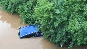 Vehicles Submerged by Floodwaters in Western Germany