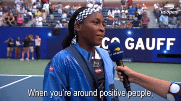 Sports gif. Tennis player Coco Gauff is being interviewed after a match. Shrugging her shoulder with a calm and pleasant demeanor as she says, "When you're around positive people you can't be negative for too long."