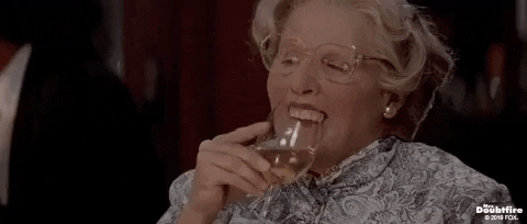 Movie gif. Robin Williams as Mrs. Doubtfire takes a sip of her drink, losing her veneers, and they plop into the glass.