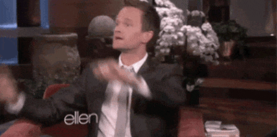 Celebrity gif. Neil Patrick Harris, seated on the guest's couch on Ellen, looks around before pointing at us and saying firmly, "Stop it," which also appears as text.
