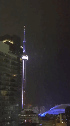 Lightning Bolt Strikes Toronto's CN Tower on Stormy Night