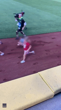Mascot Bull Knocks Over Child During Race
