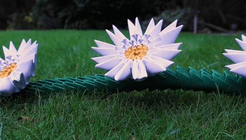tmbstudios giphyupload daisy origami paper art GIF