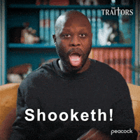 Sponsored gif. Traitors cast member Bob the Drag Queen gasps and grasps the arms of the chair he sits in. His eyes are wide in shock and his mouth is agape. Text reads, “Shooketh!”