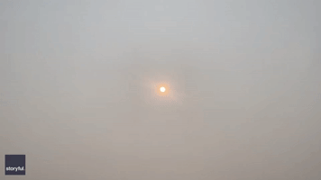 Red Sun Glows Over Manhattan as Wildfire Haze Smothers New York