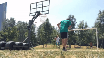 Guy Manages to Shoot a Hoop With Insane Crossbar Shot