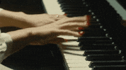 thefabelmans piano melody performing steven spielberg GIF