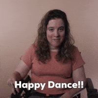 Reaction gif. A Disabled white-presenting Latina woman with cerebral palsy and kinky-curly brown hair, does donuts in her motorized wheelchair. Text, "Happy dance!"