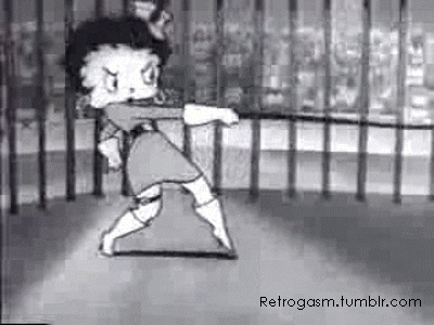 Cartoon gif. Betty Boop is angrily using a whip, lashing at while wearing high heeled boots.