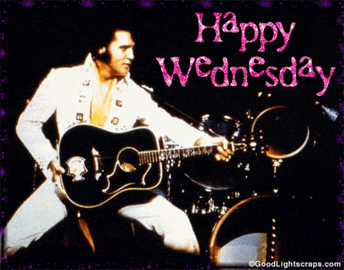 Digital art gif. A superimposed still image of Elvis Presley performing. He’s in a power stand, looking off to the side, and holding his guitar almost like a cannon as if to point towards someone. In pink sparkly letters, it says, “Happy wednesday” and a purple moving frame highlights the image. 