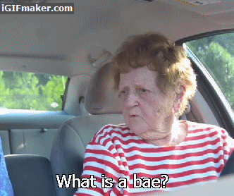 Video gif. An elderly woman sits in a car and looks with a confused gaze to someone near her. Text, "What is a bae?"
