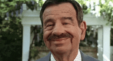 Movie gif. Walter Matthau as Mr. Wilson from Dennis the Menace gives us a buck-toothed smile. The front teeth of his dentures have been replaced with Chiclets.