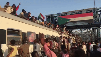 Protesters Ride Roof of Khartoum-Bound Train