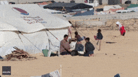 Displaced Gazans Bake Bread Amid Sea of Tents Along Egypt Border
